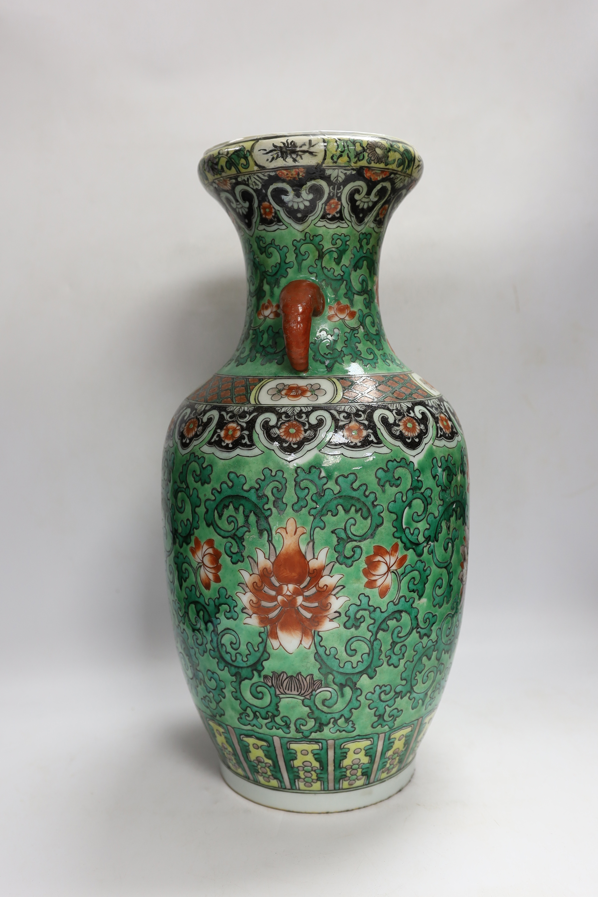 A Chinese green ground enamelled porcelain vase, Kangxi mark but late 19th century, 45cm